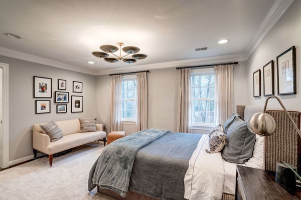 Cozy bedroom with curtains and couch and warm colors
