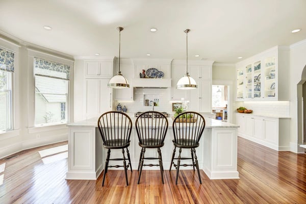 White country kitchen remodel with large island and hard wood floors