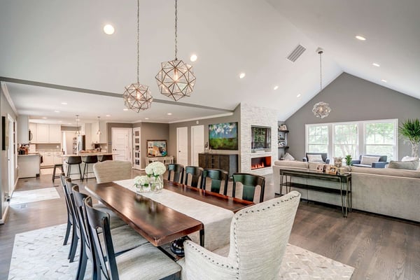Open concept first floor with high, cathedral ceilings and pendants lights