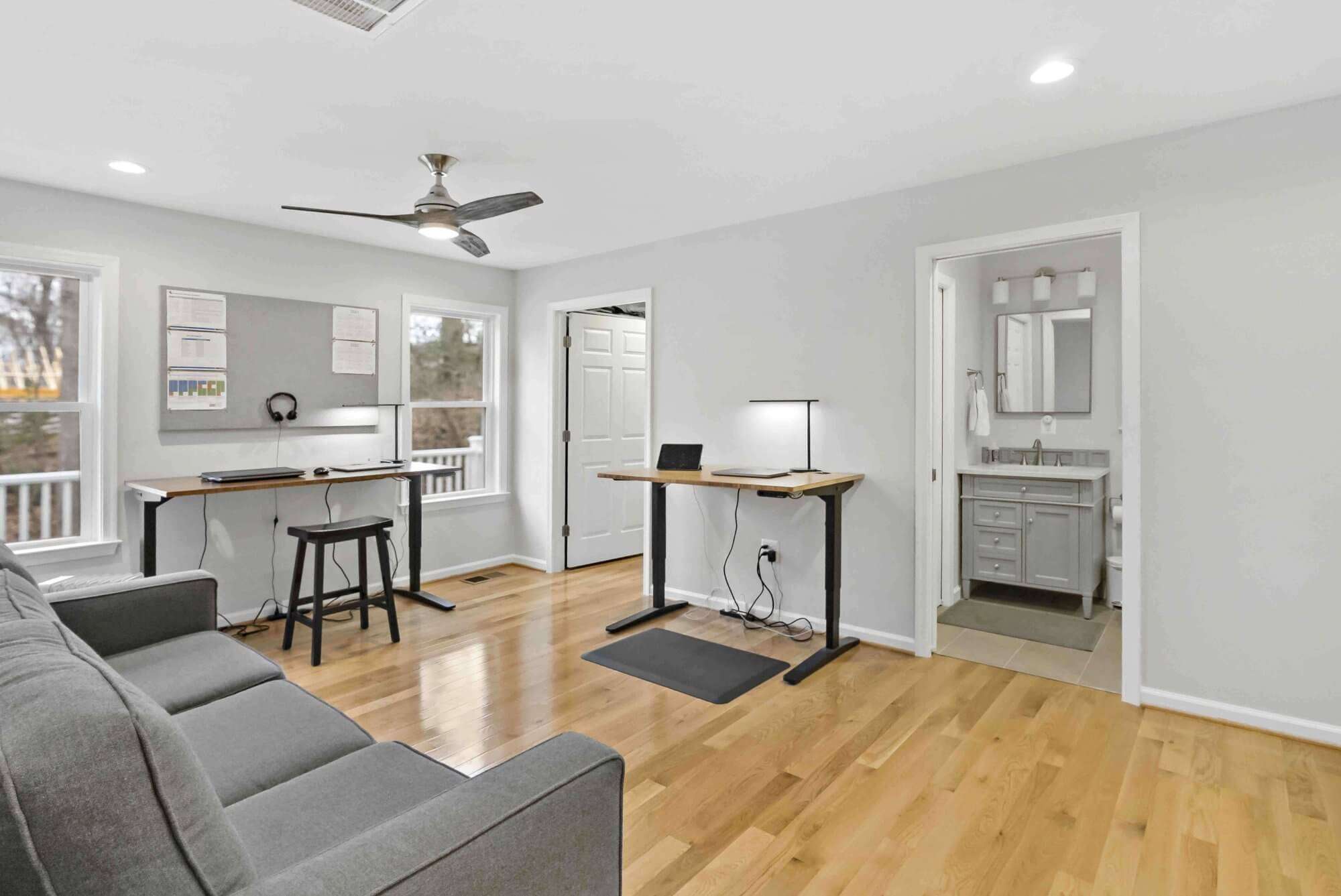 Office space with attached bathroom and ceiling fan