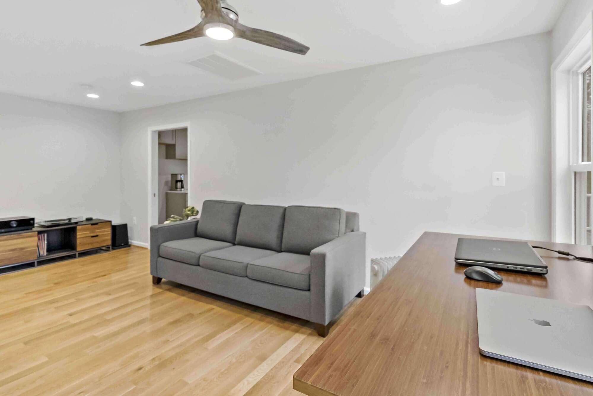 Open space room with desk and couch
