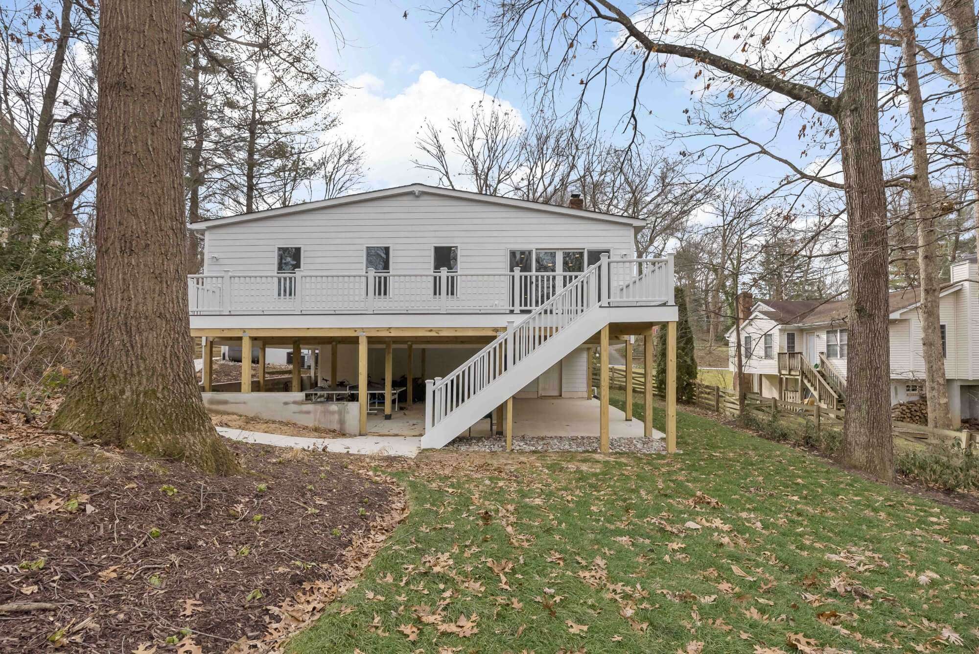 Raised porch with stairs leading to main level
