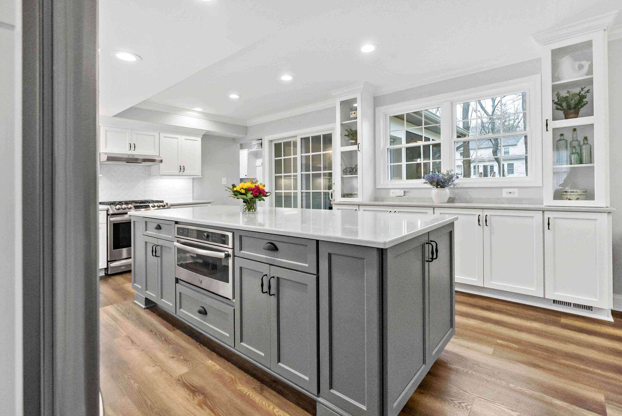 White kitchen with light grey rectangular kitchen island
