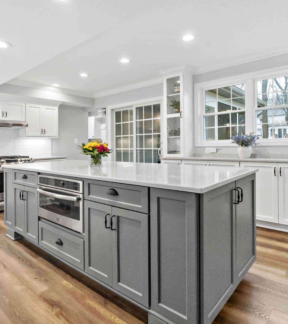White kitchen with grey island
