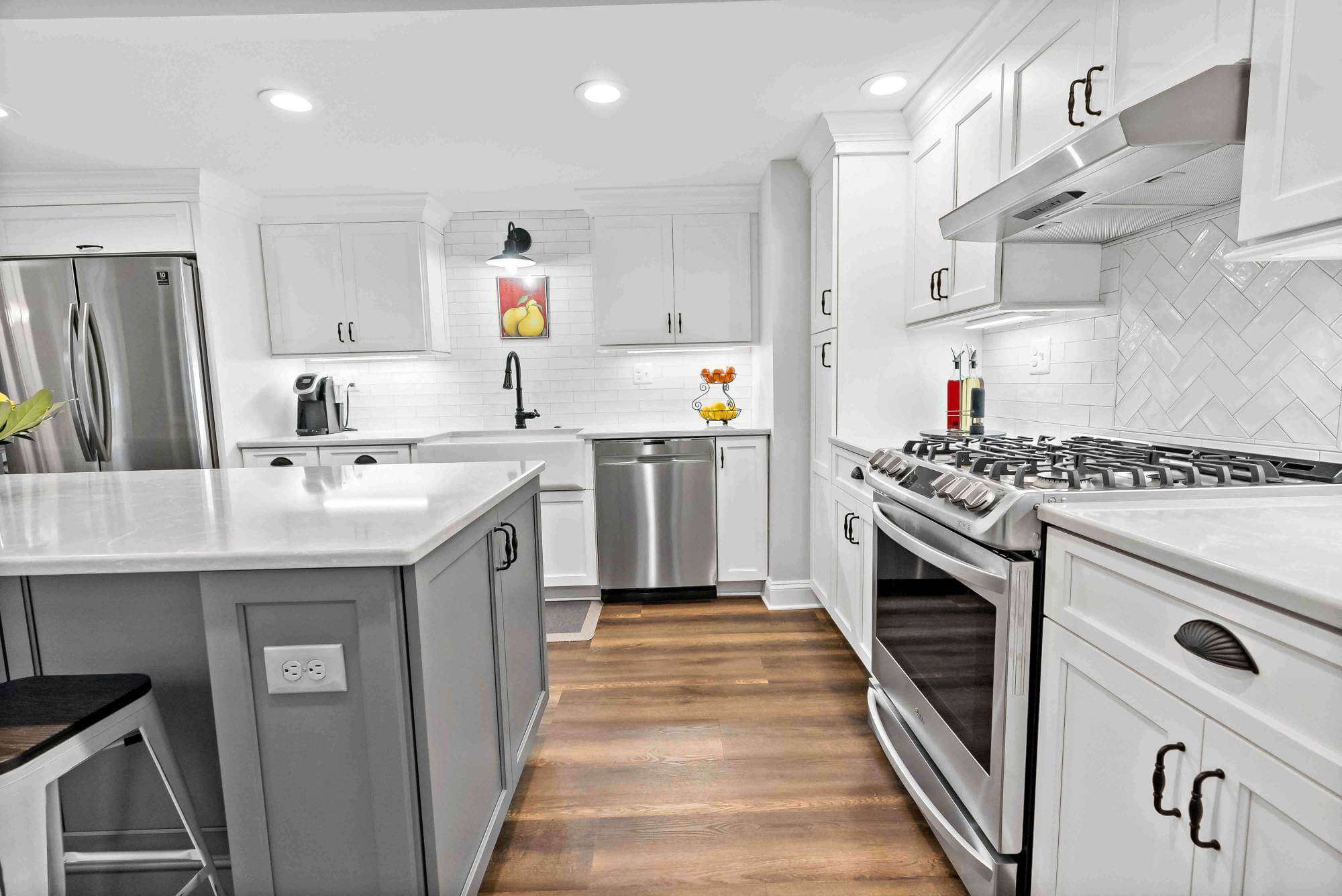 White cabinets with black handles in kitchen