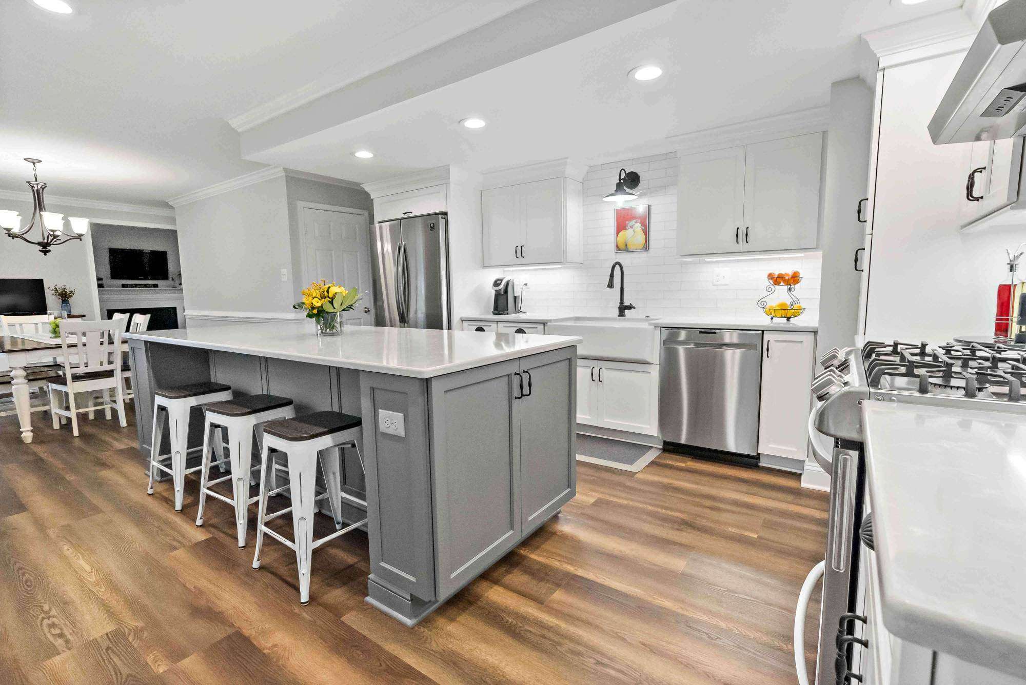 Grey kitchen island with bar stool seating