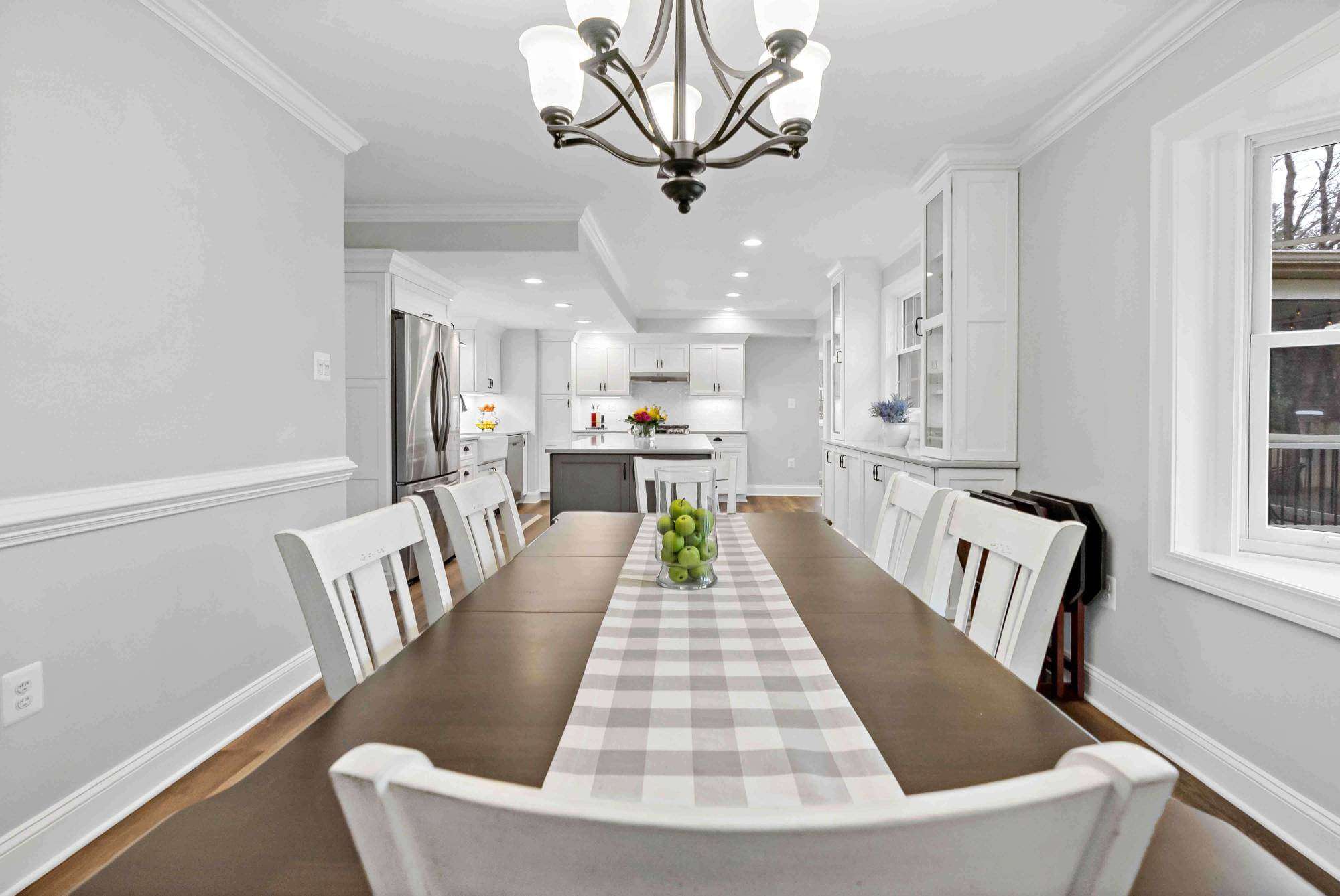 Wood dining room table with chandelier