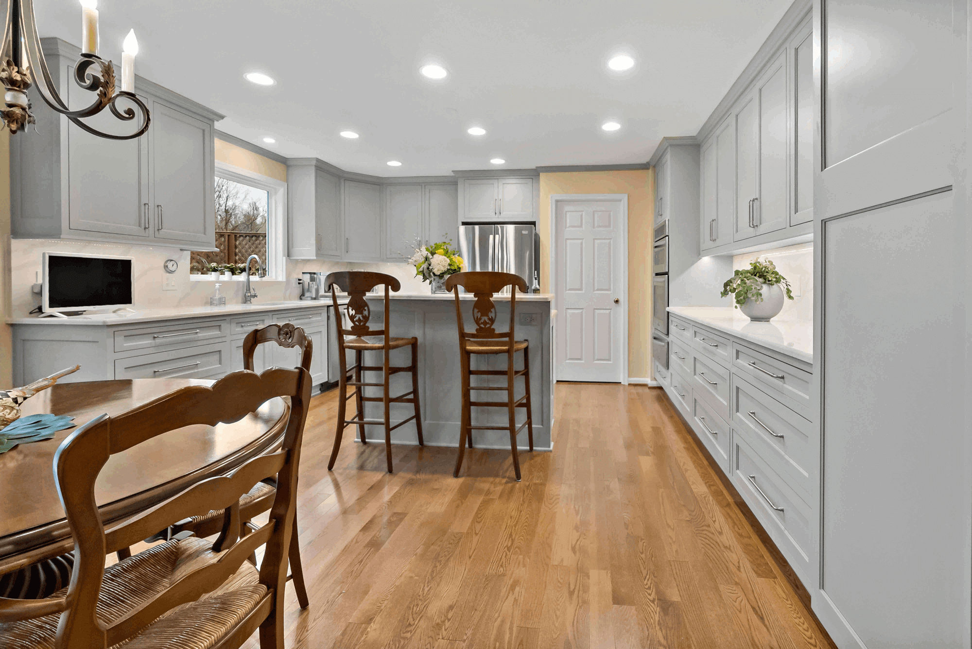 Grey cabinets and white countertops in kitchen
