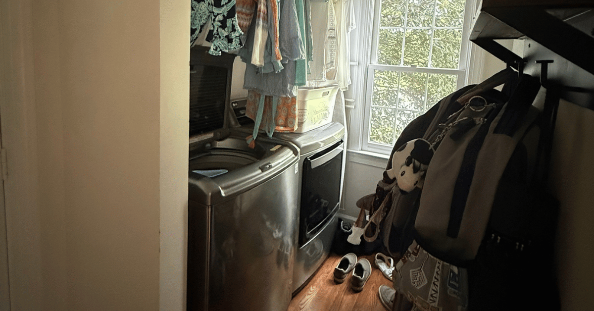 Before: cluttered laundry space