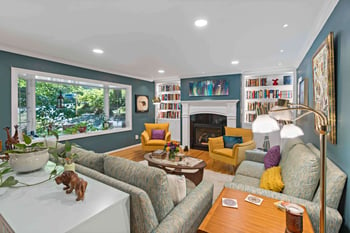 Blue walls and white built-in shelves in living room