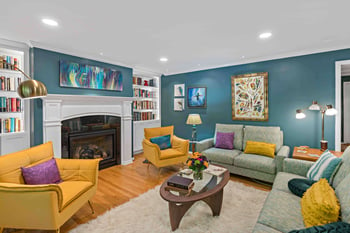 Colorful living room with blue walls and yellow furniture