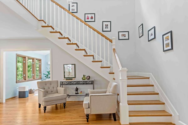 Brown and white staircase with landing