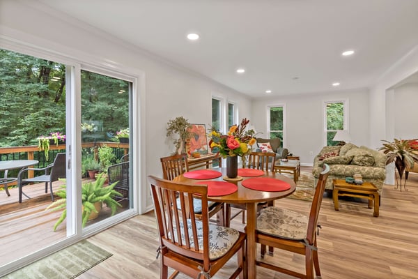 Kitchen table with sliding door access to outdoor deck