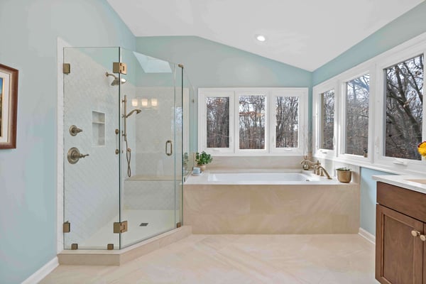 Light blue walls and cream beige flooring in full bathroom