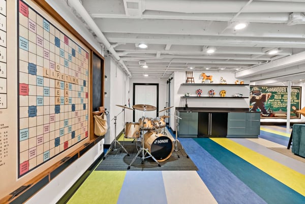 Retro colored basement with scrabble wall and musical instrument space