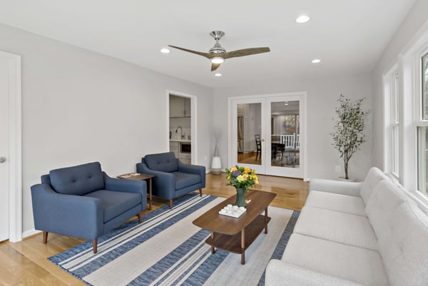 Living room with blue fabric chairs and light grey couch