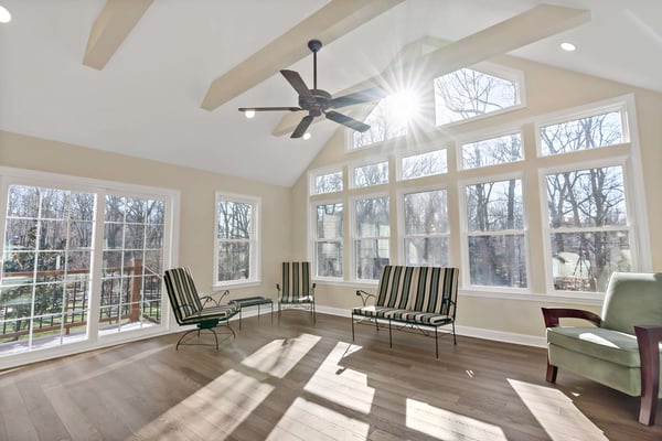 Sunroom with cathedral ceilings and large windows