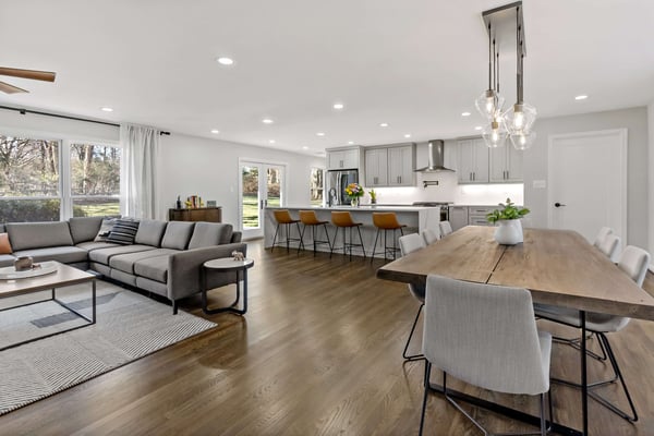 Modern interior remodel with open concept kitchen, dining, and living room area