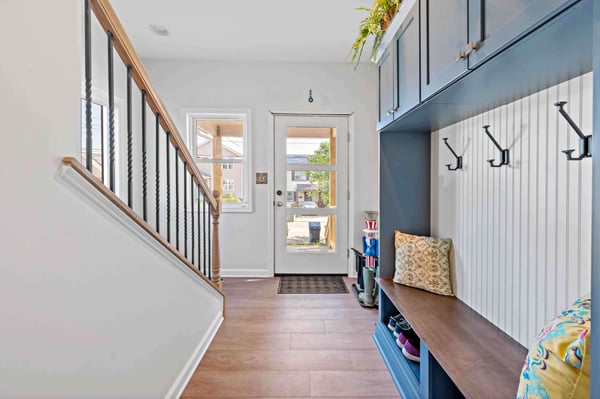 Blue mudroom in entryway of home