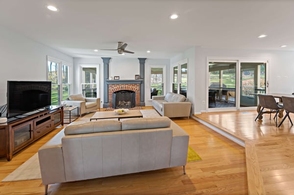 Open concept kitchen and living room with hard wood floors and fireplace