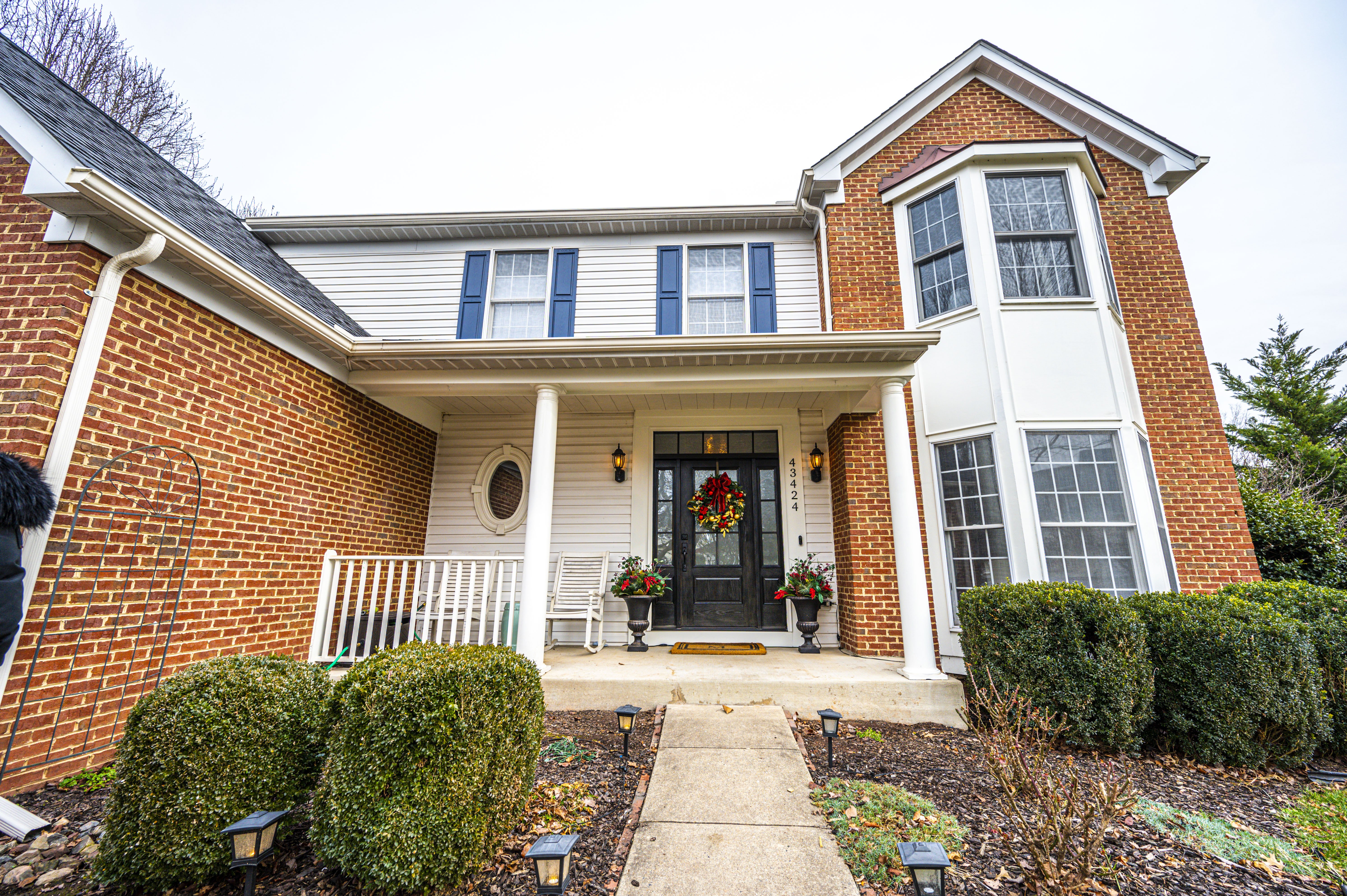 Front door exterior of red brick home