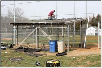 Moss Building & Design working on new roofs for Chantilly Little League