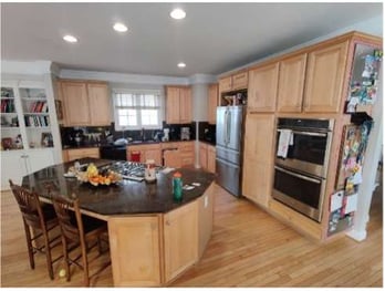 Kitchen before remodel with circular island