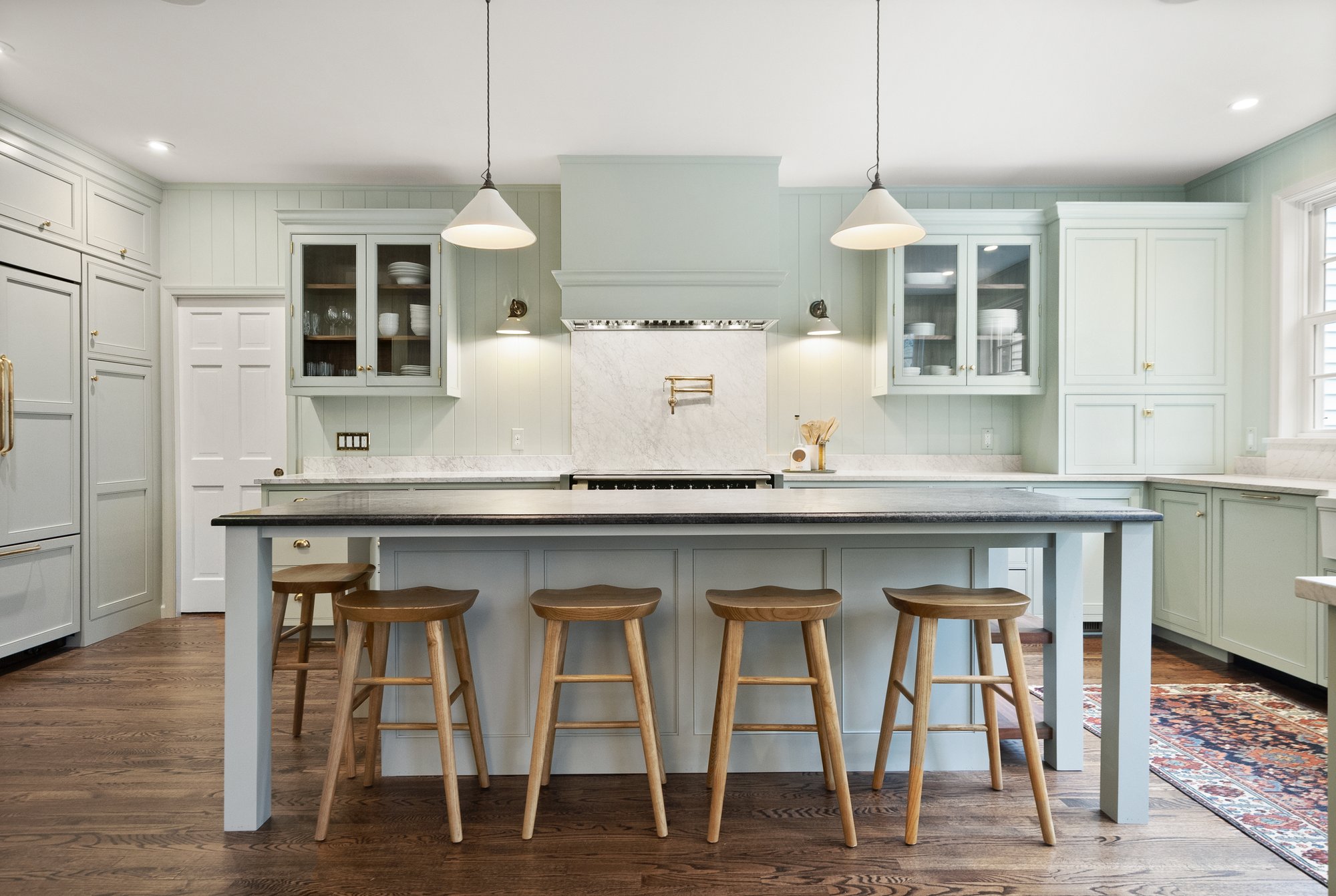 Great Falls, VA kitchen remodel showcasing luxury French range and beadboard wall