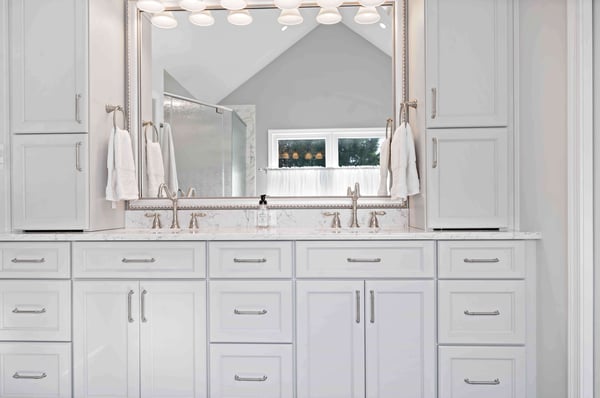 White kitchen with lots of cabinetry on vanity for storage