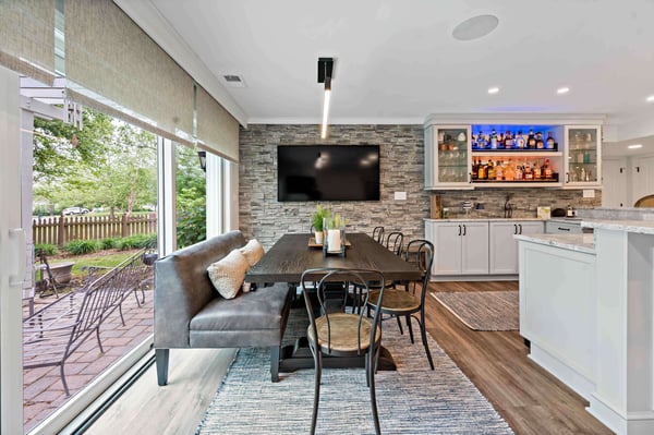 Basement kitchen and dining room area with backyard view and access