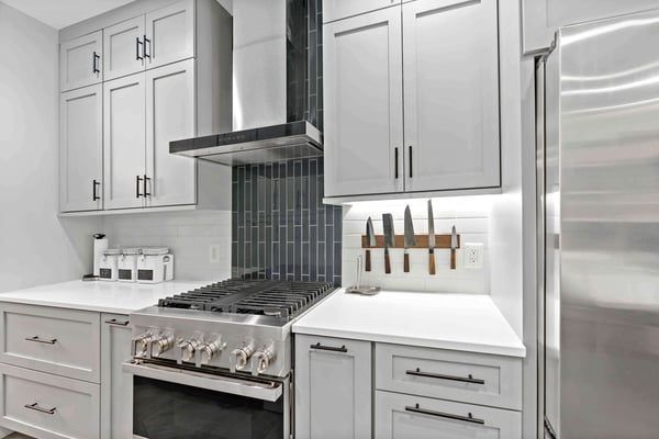 White kitchen with magnetic strip to hold knives
