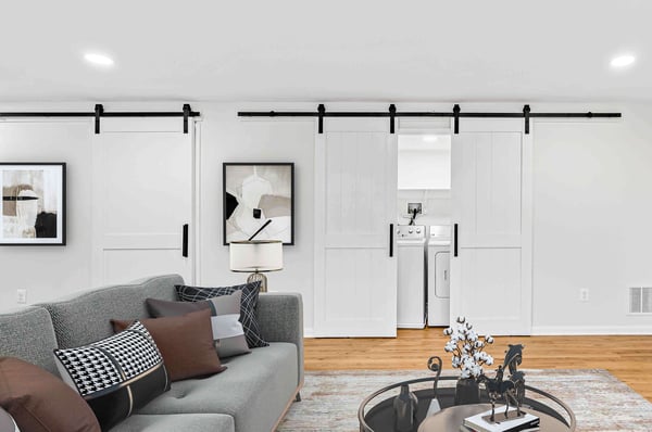 White sliding barn door to cover laundry room