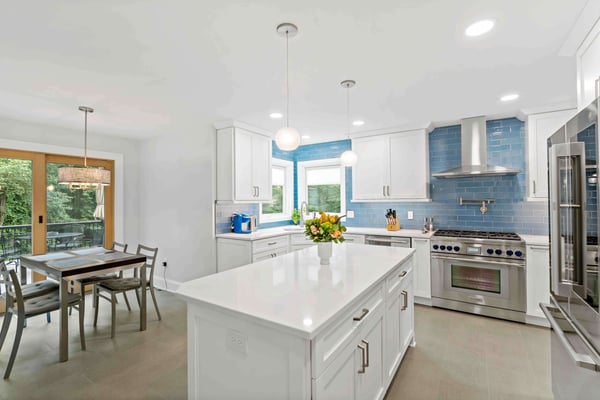 Blue rectangular tile backsplash in modern white kitchen