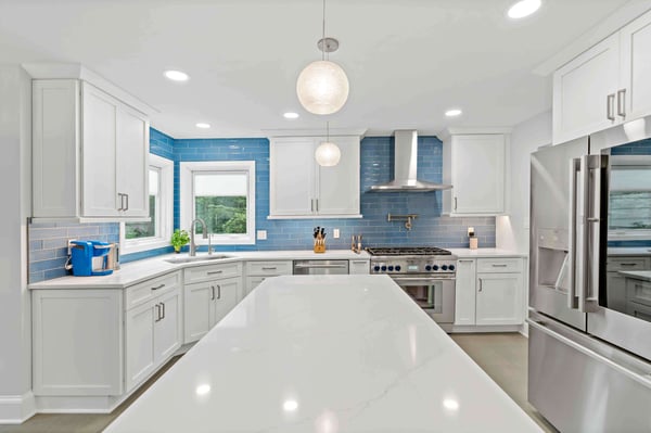 Blue rectangle tile backsplash in white kitchen
