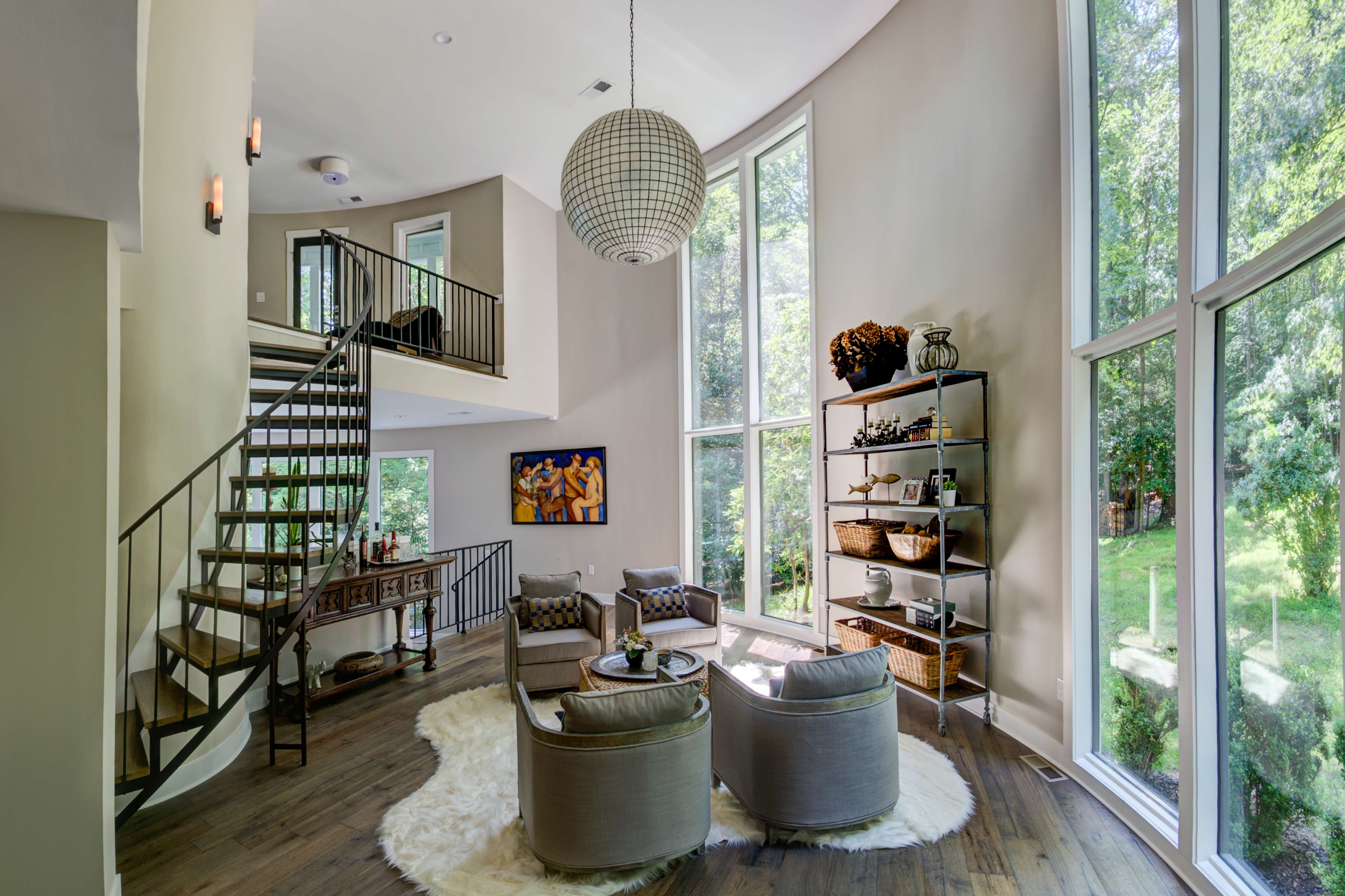 Living room with tall ceiling and tall windows