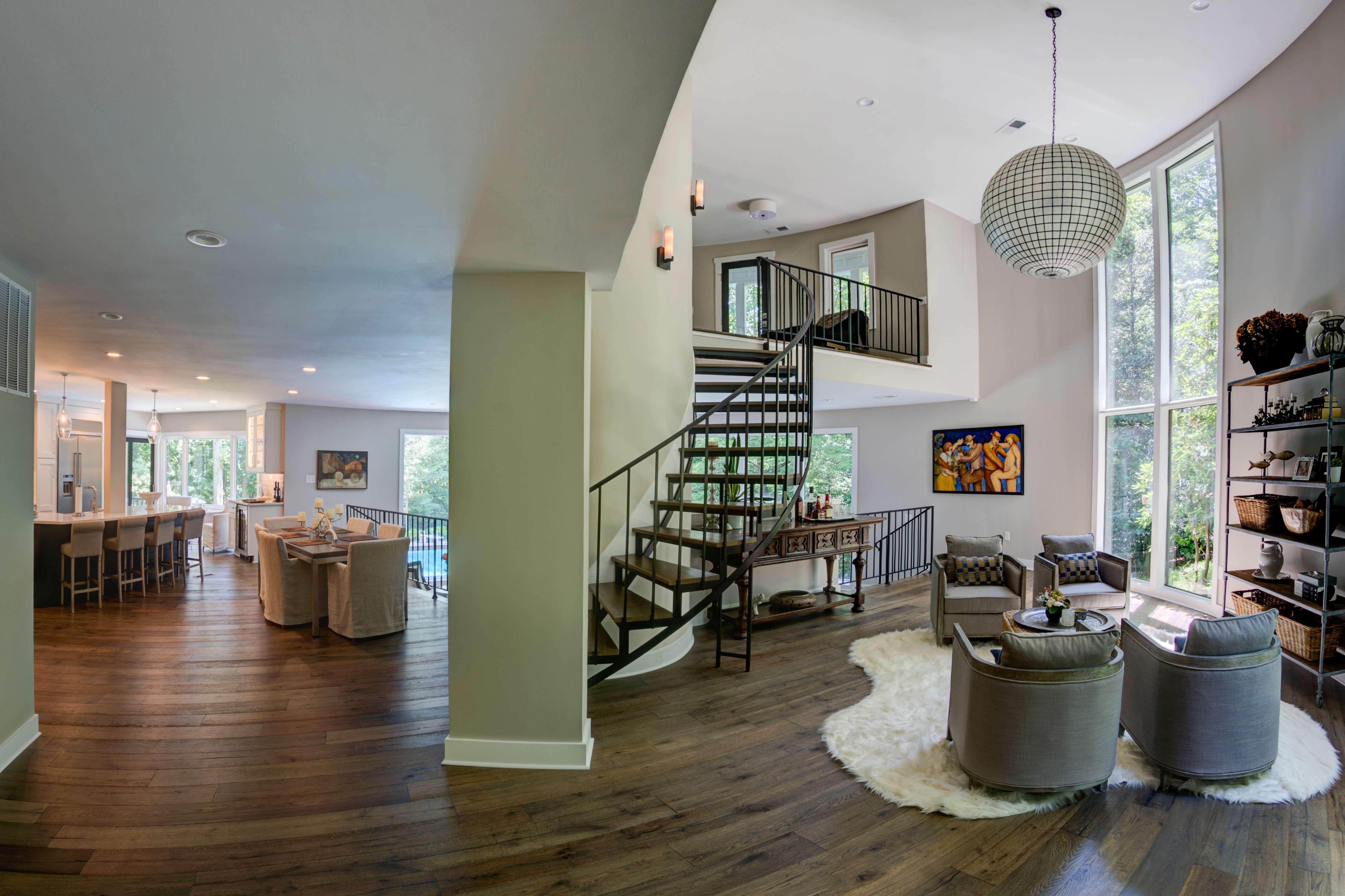 Open concept with living room and kitchen with spiral staircase