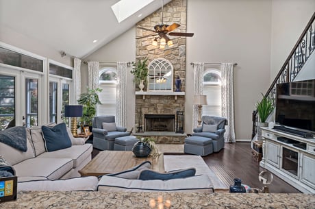 Bright living room with stone fireplace in Centreville