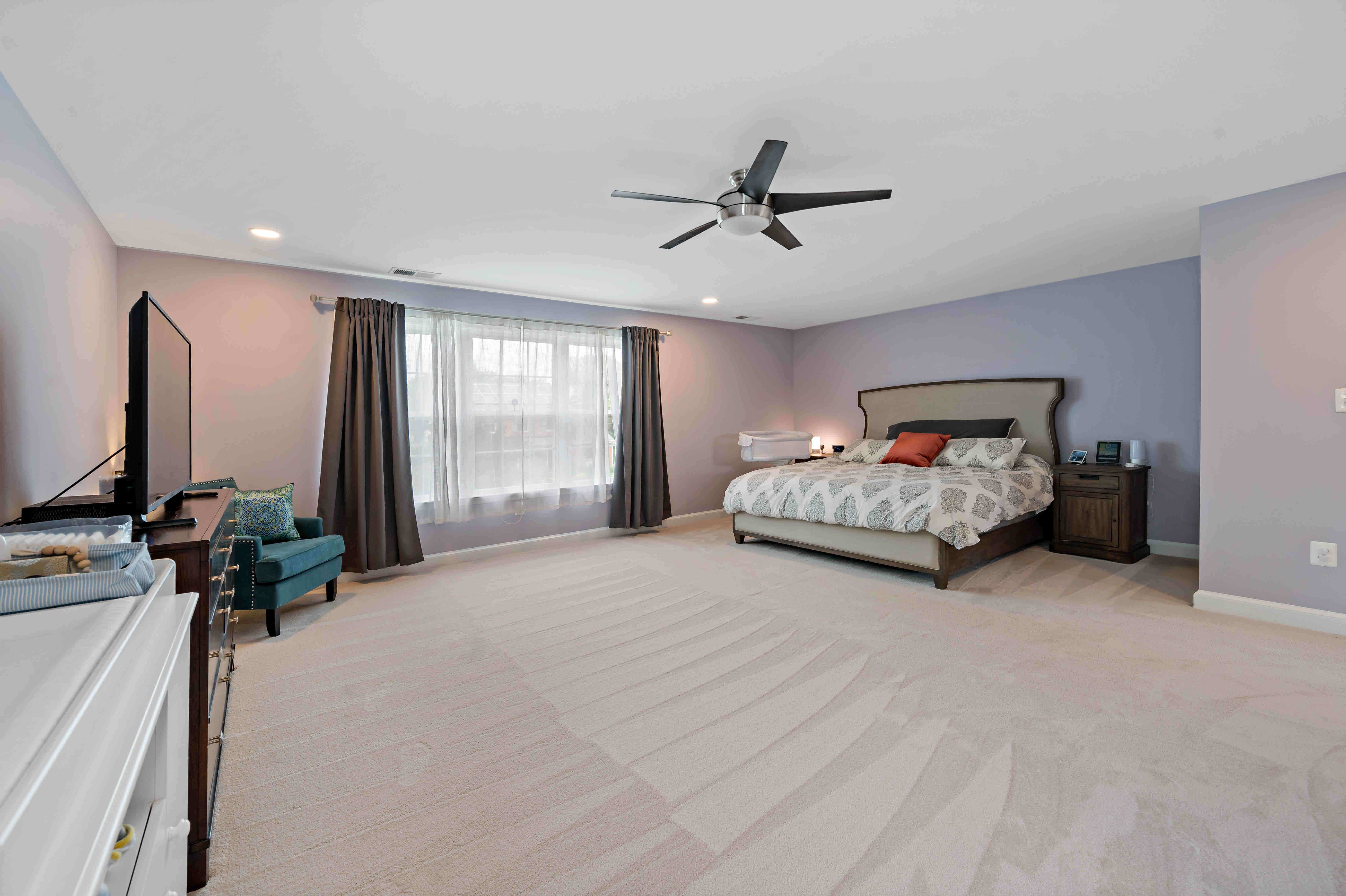 White ceiling and purple walls in bedroom