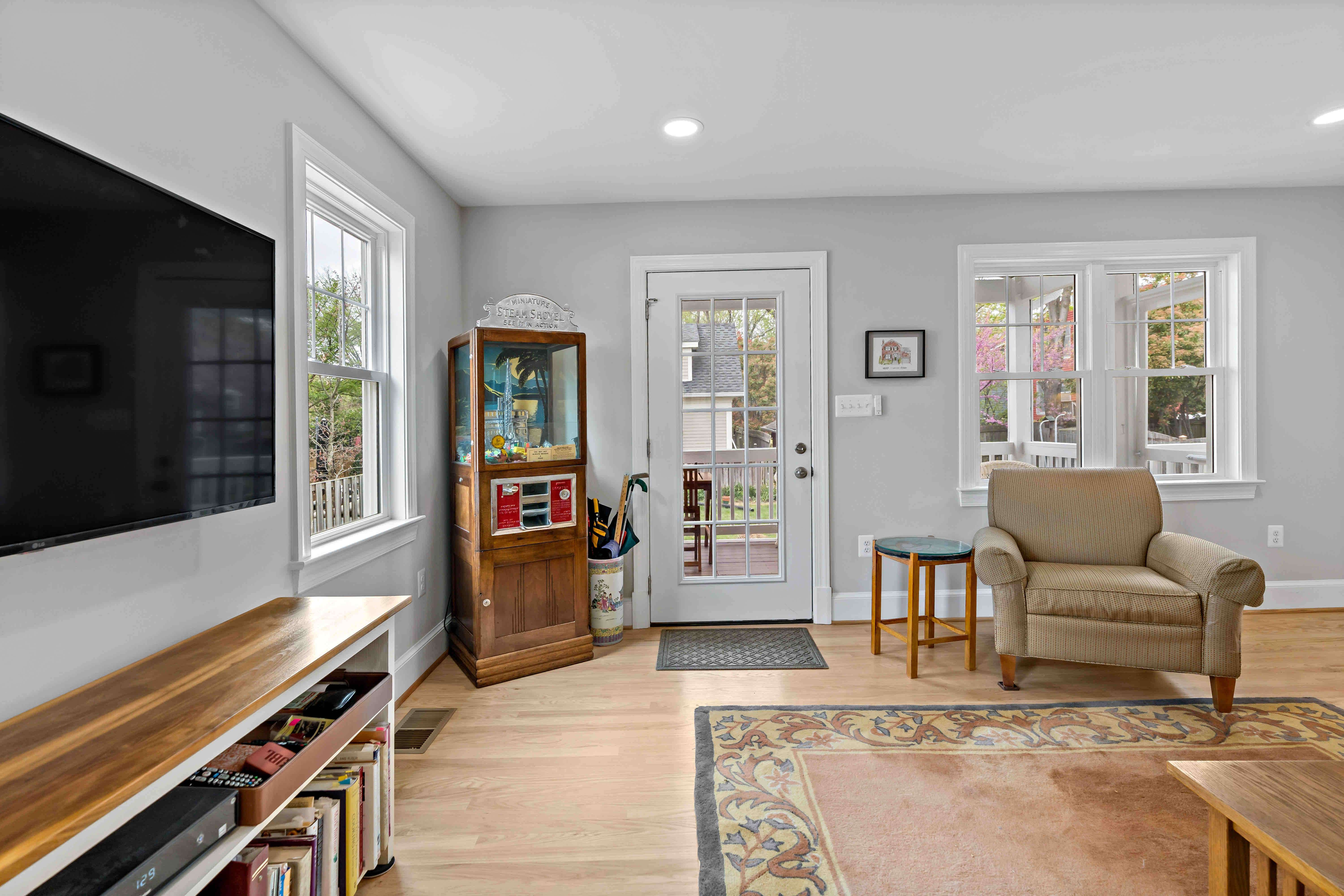 TV room with back door entrance to a screened porch