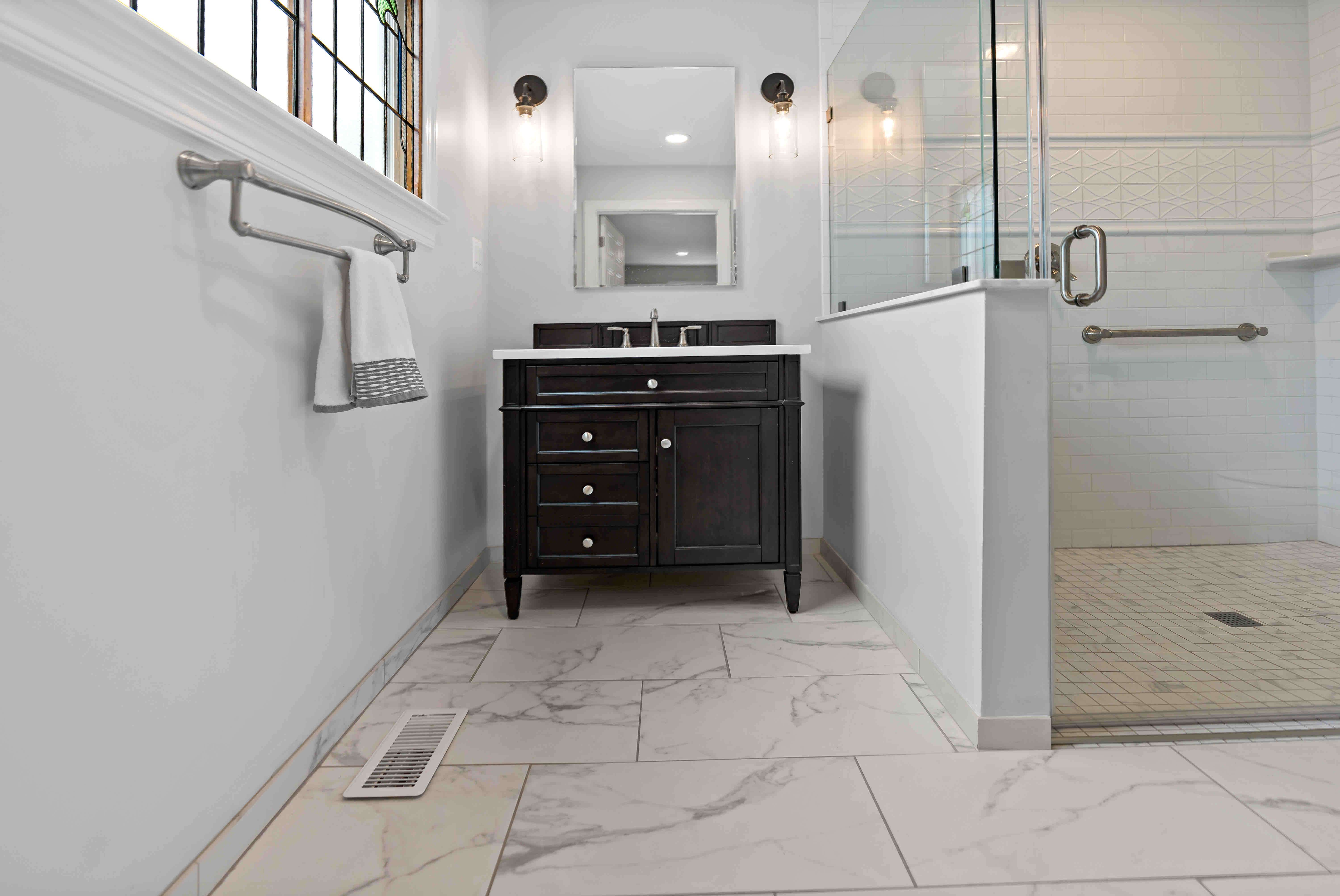 Marble tile floor in full master bathroom