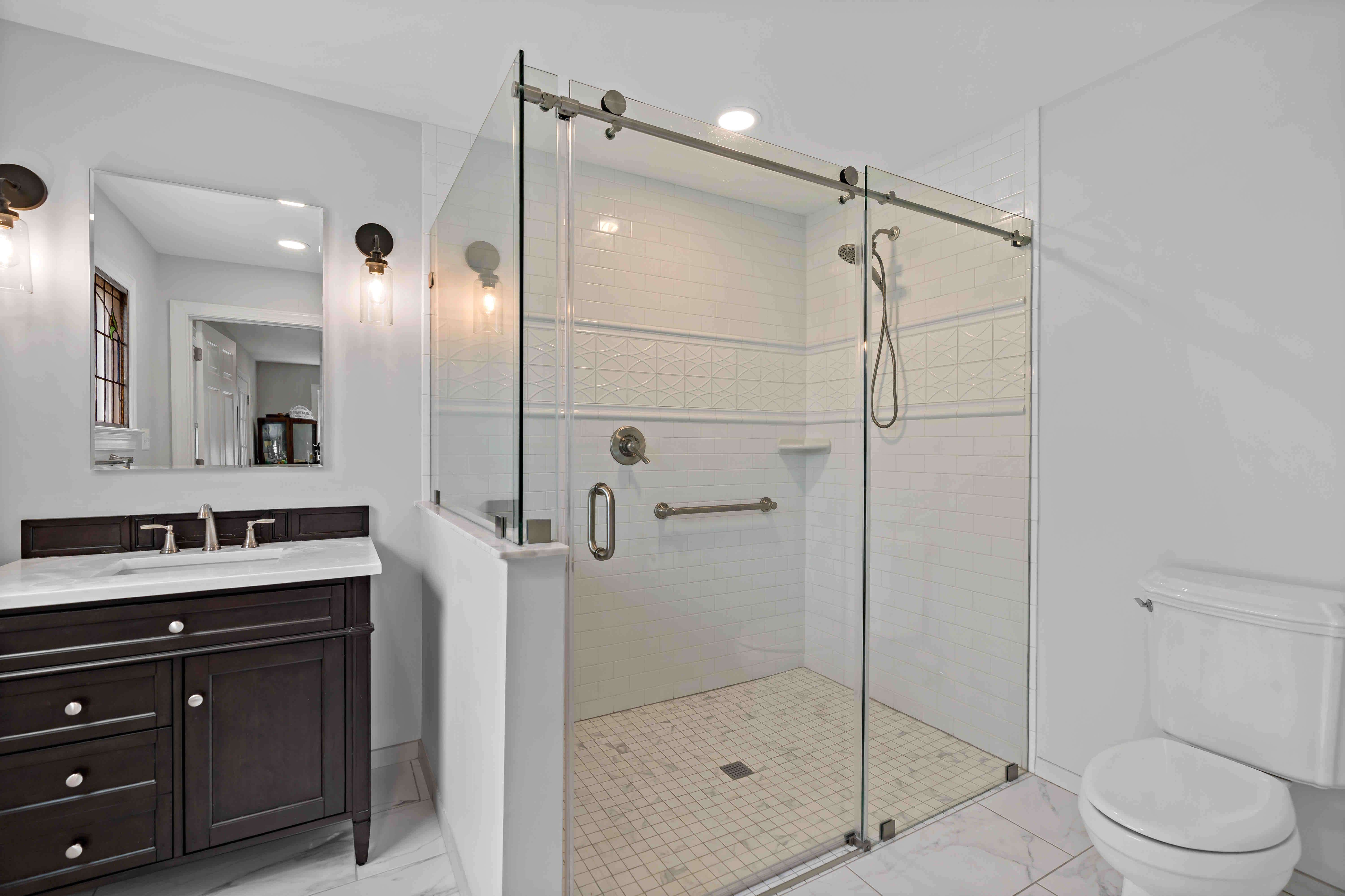 Master bathroom with single vanity and large stand up shower