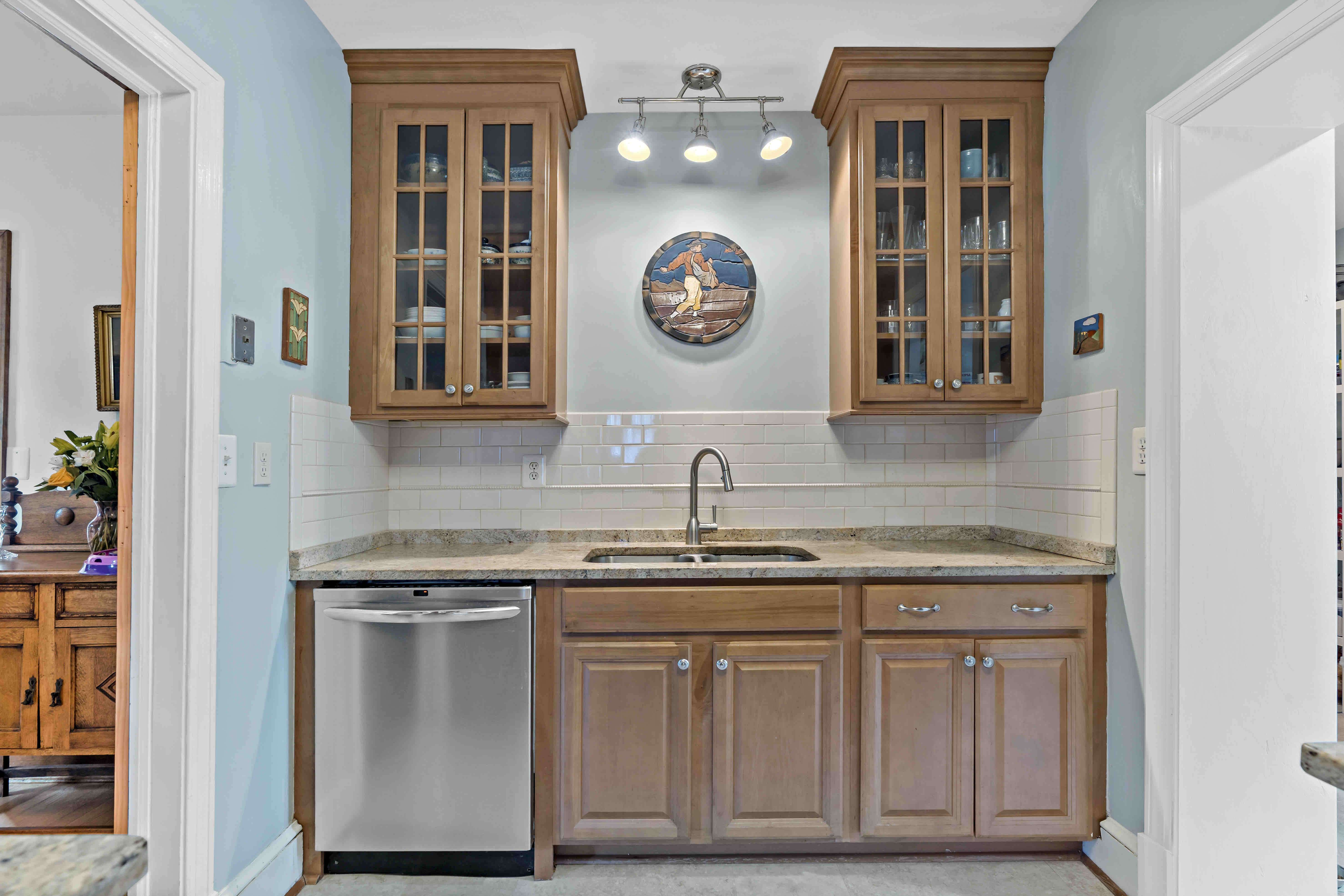 Brown cabinets with light brown countertop in kitchen