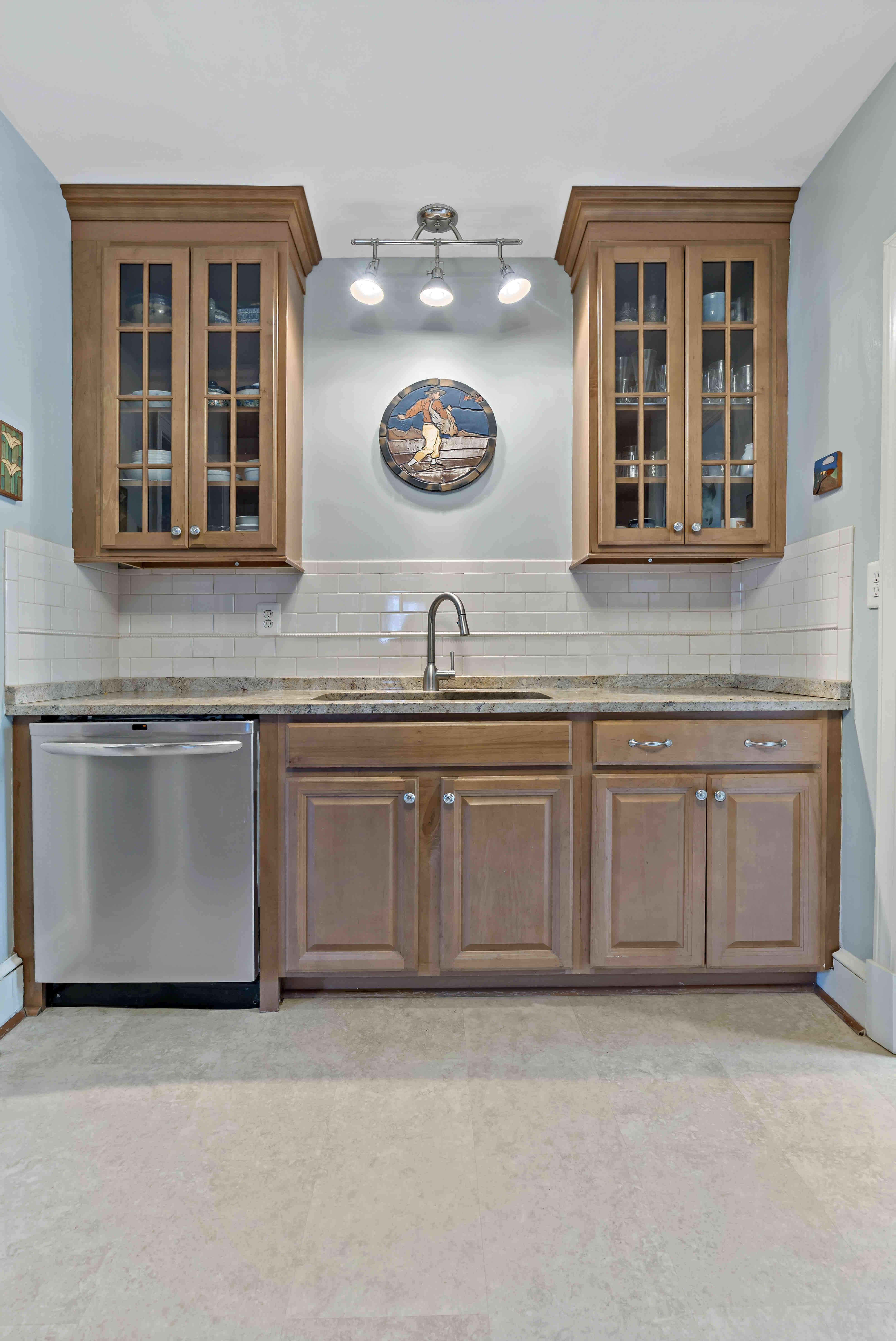 Drink display with clear kitchen cabinets and small sink