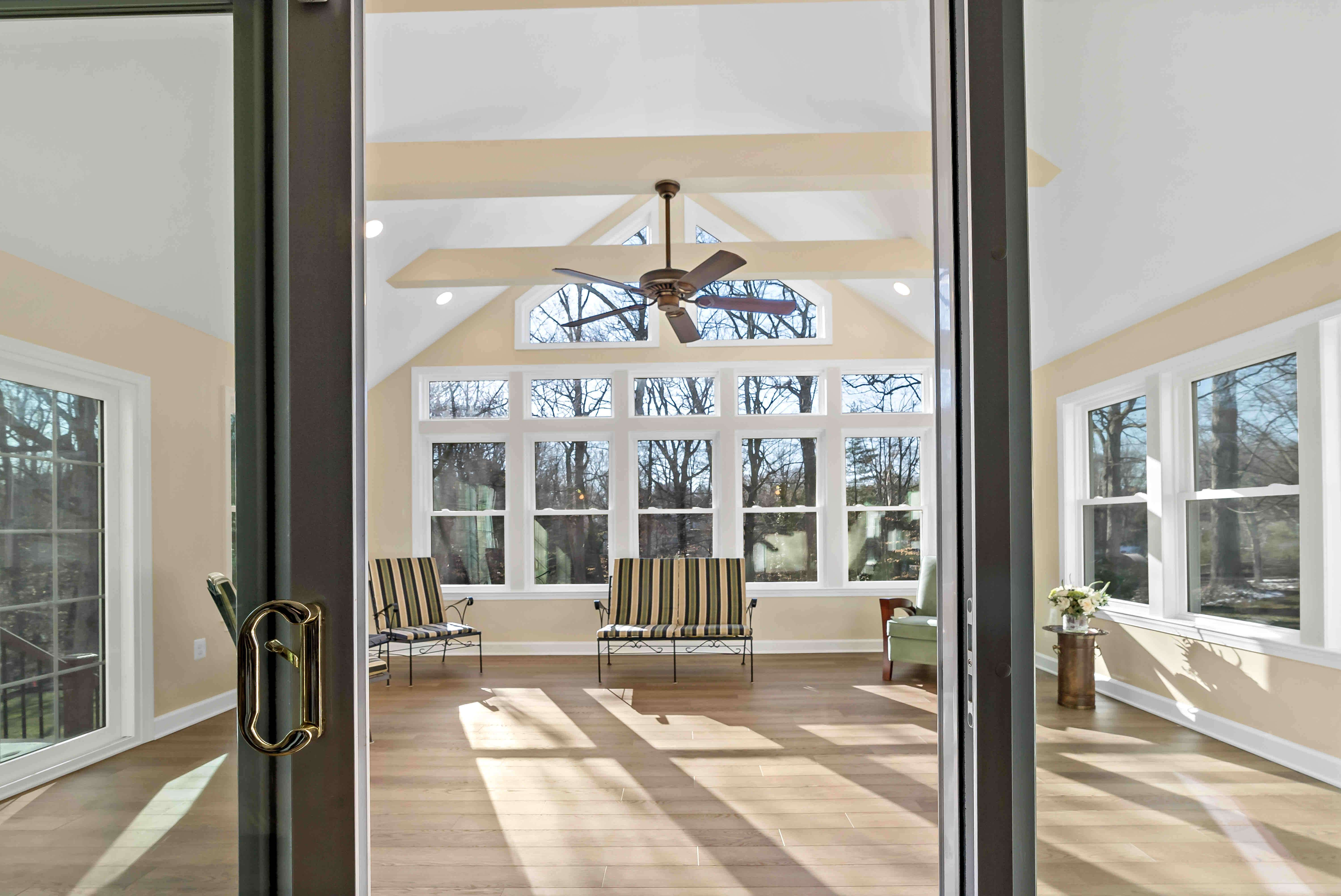 House entrance to sunroom through a sliding door
