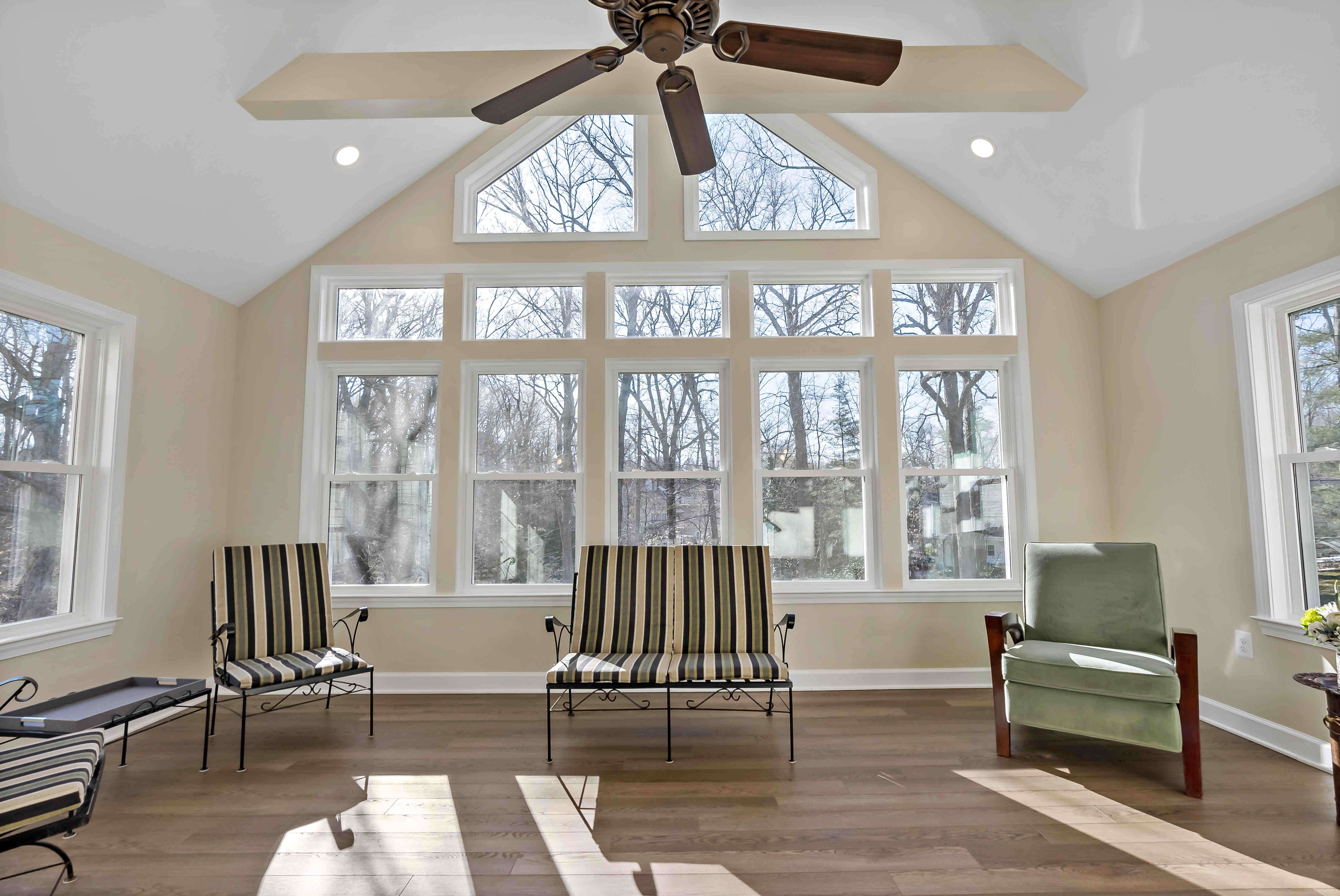 Cathedral ceiling and hardwood floors in room addition