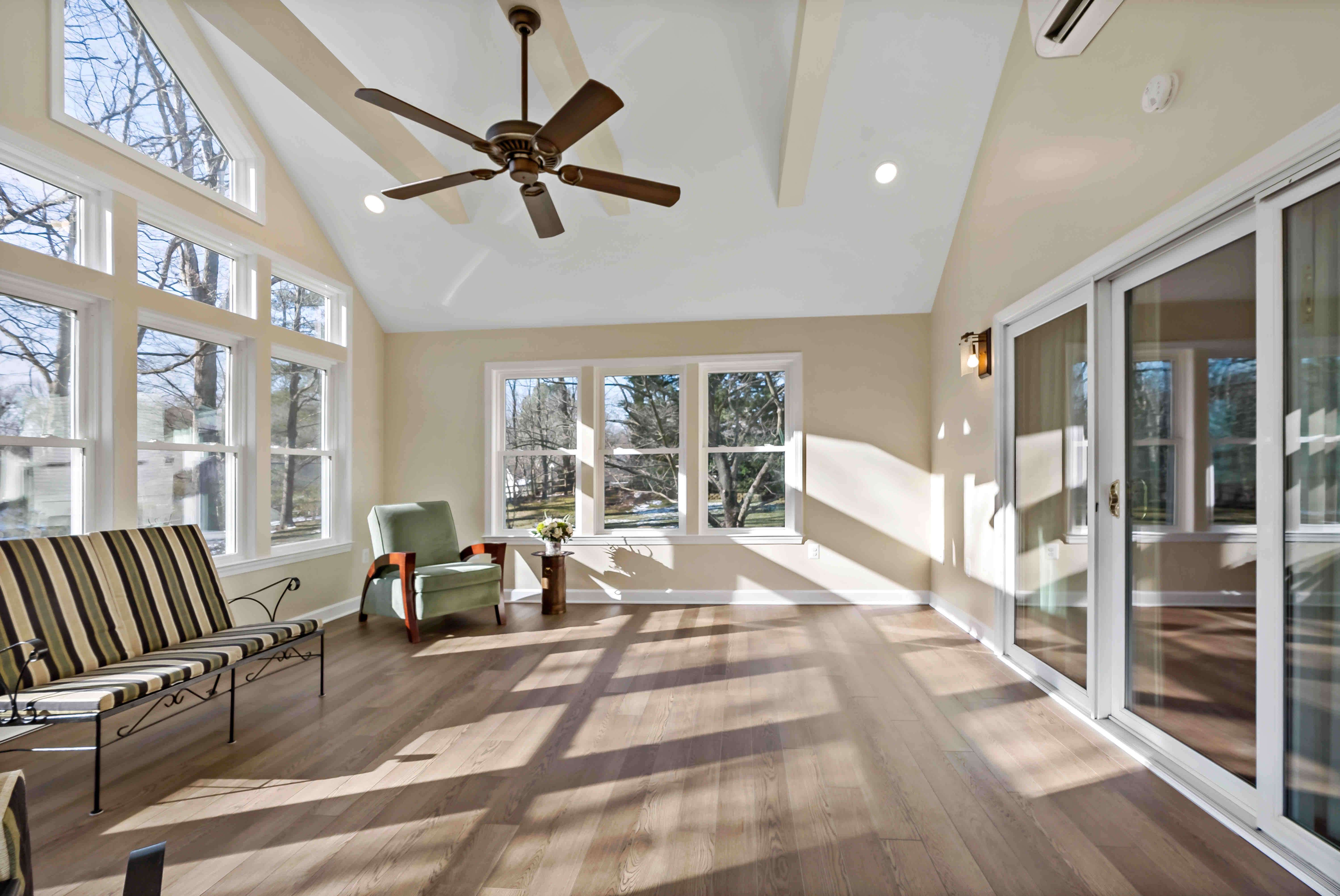 Hardwood floors and white windows in sunroom
