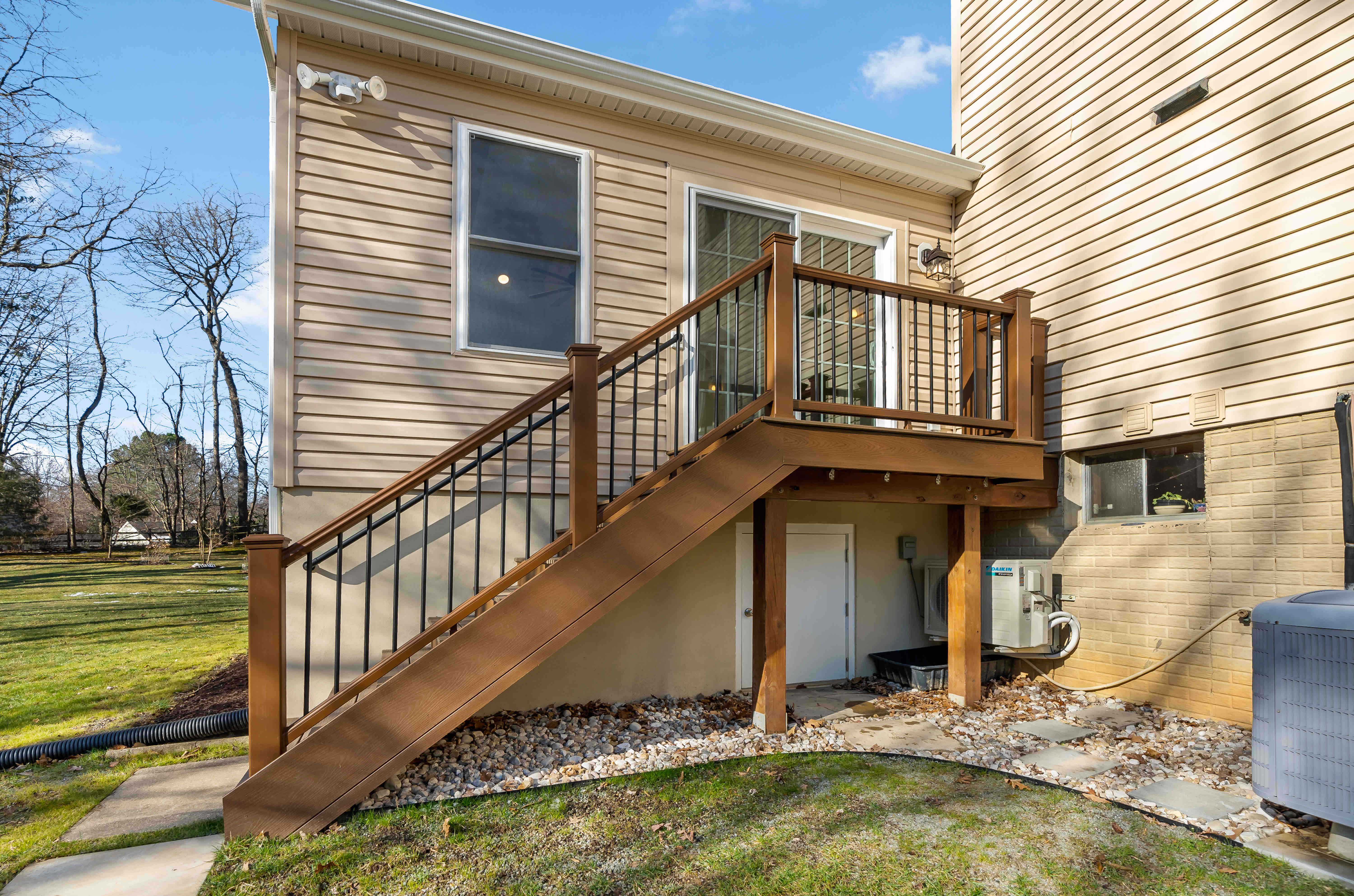 Outside wooden staircase leading up to house