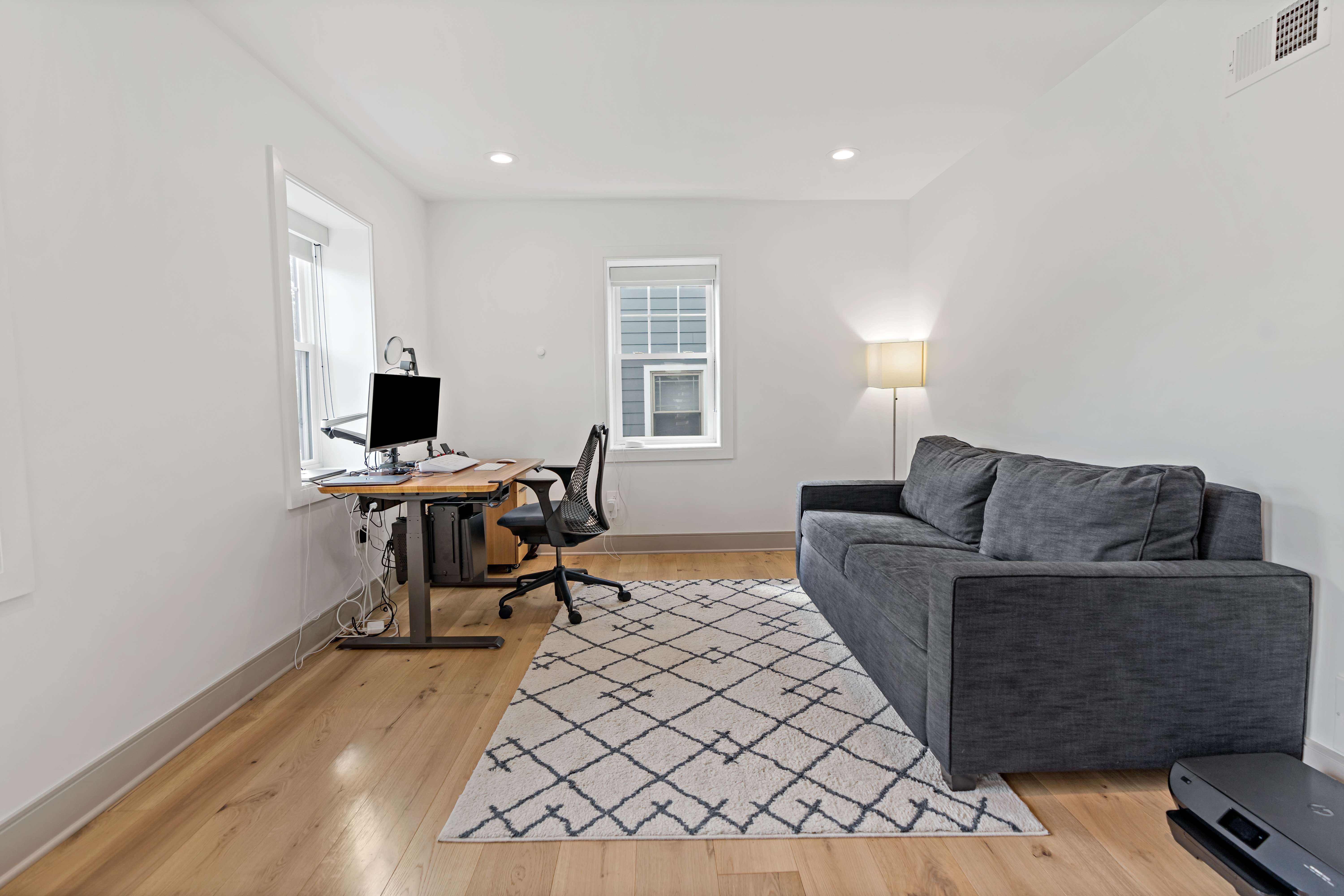 Office or study room with white walls and hard wood floors