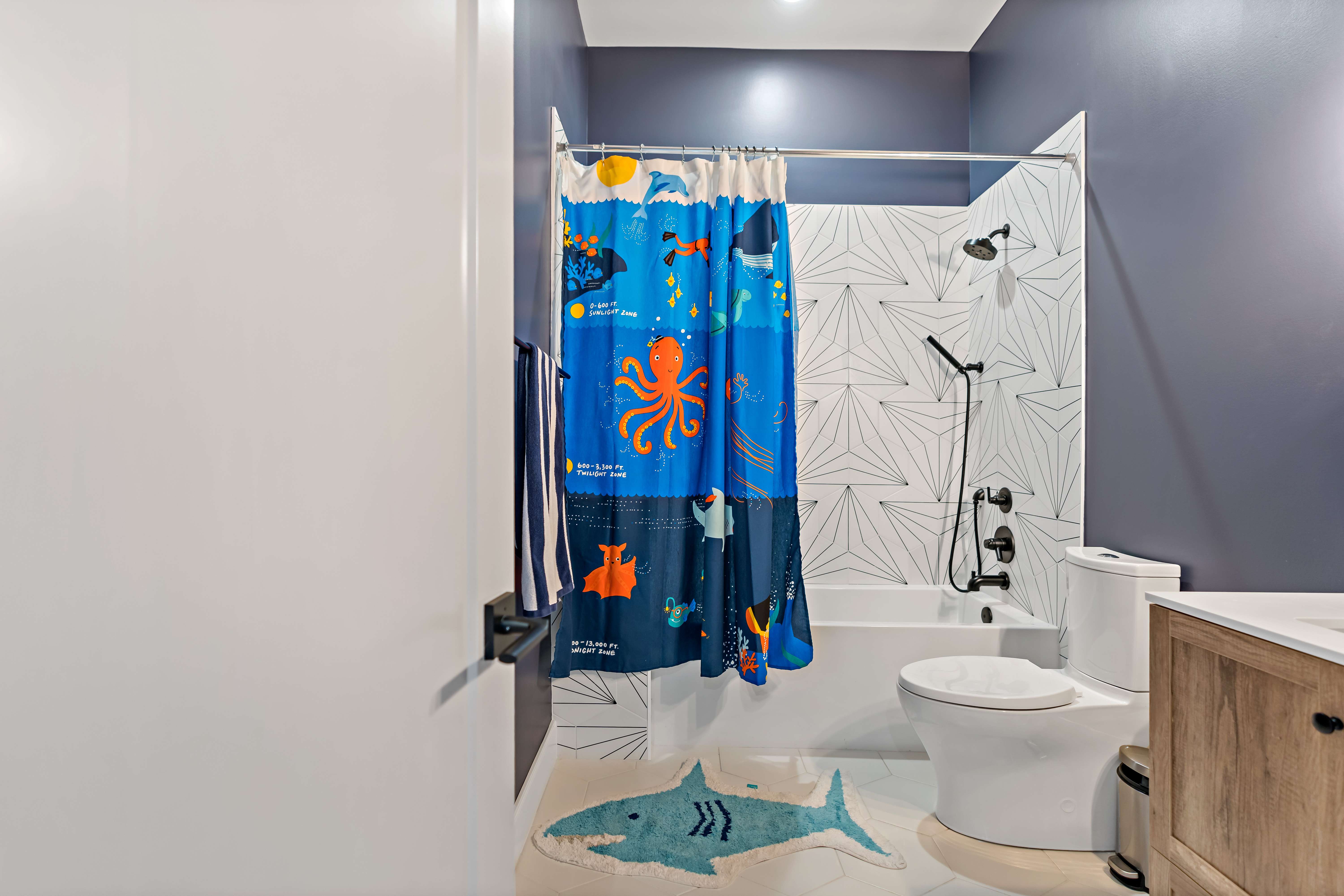 Children's bathroom with bathtub shower combo