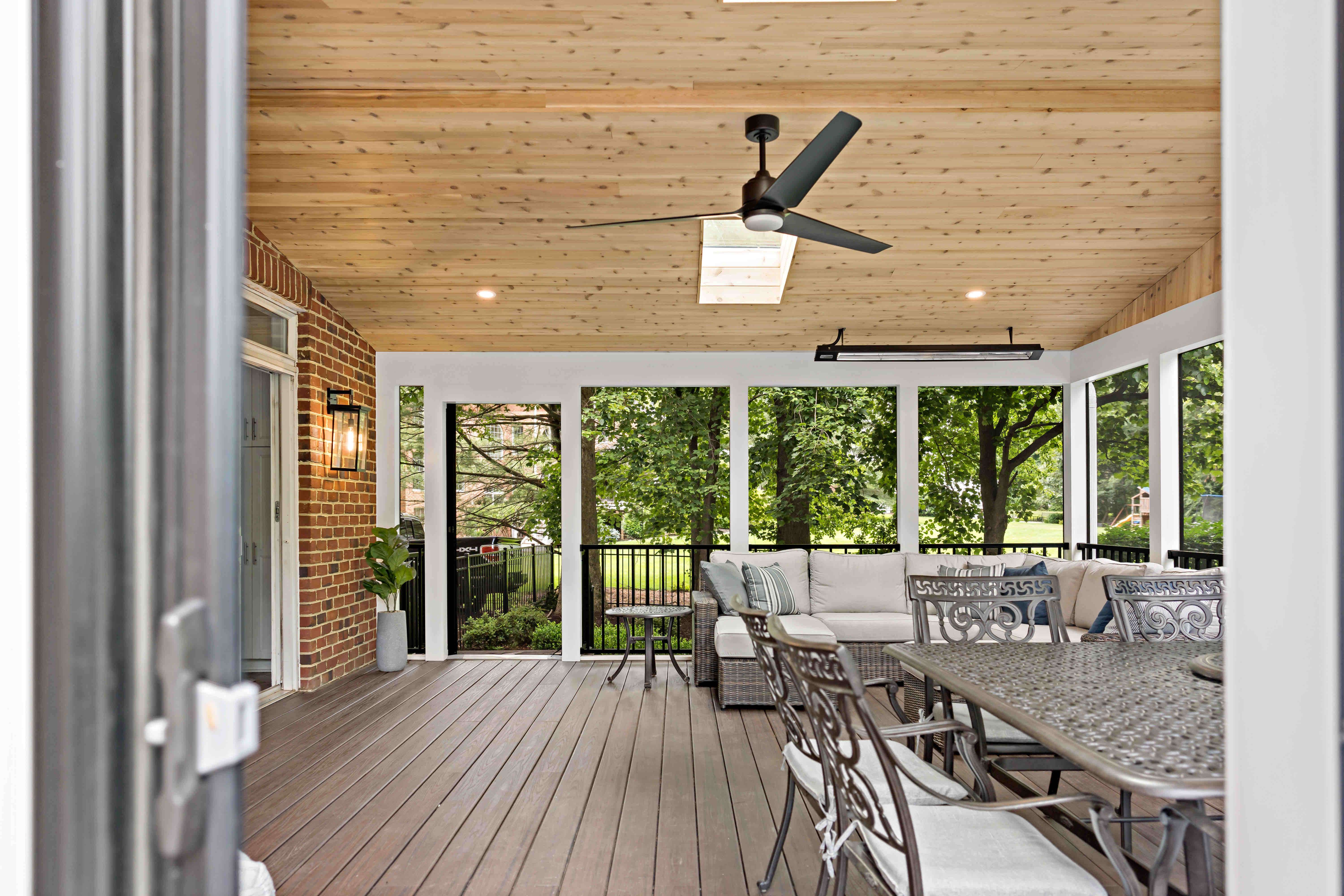 Screened porch with wood paneling vaulted ceiling